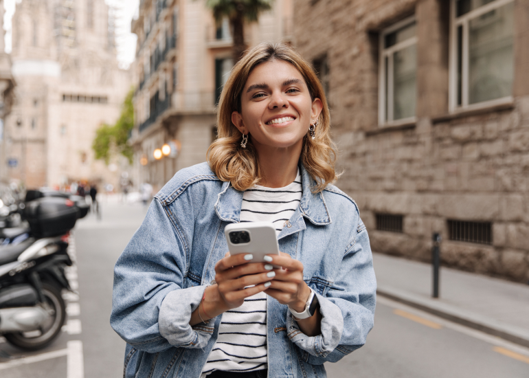 A woman using a smartphone for AI in travel
