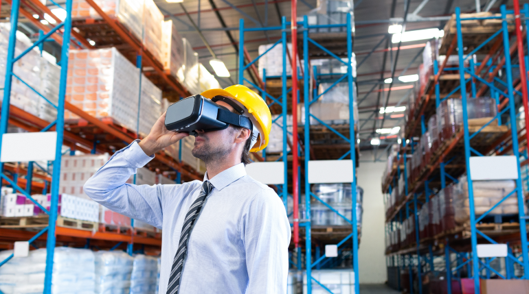 A warehouse operative wearing VR/AR goggles.